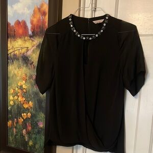 Elegant Black Top with Embellished Neckline